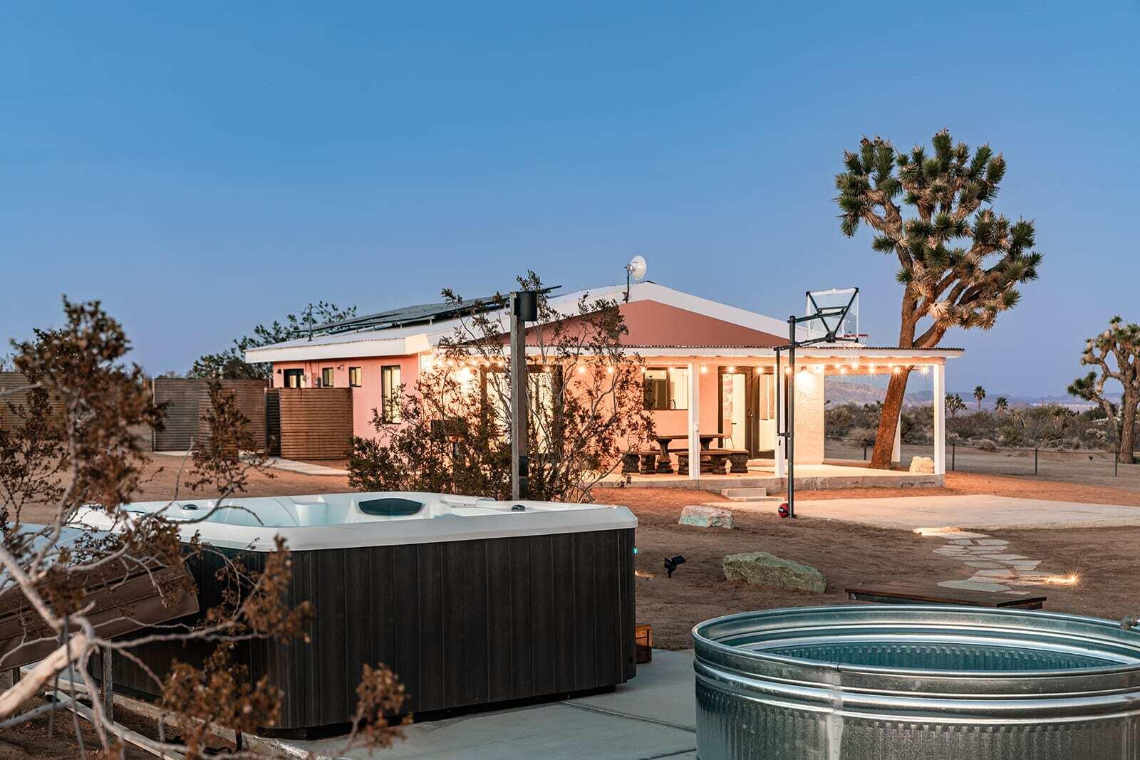 55717 Ruth Lane Yucca Valley, CA 92284 - Photo 5 of 32 a view of a patio with table and chairs and potted plants