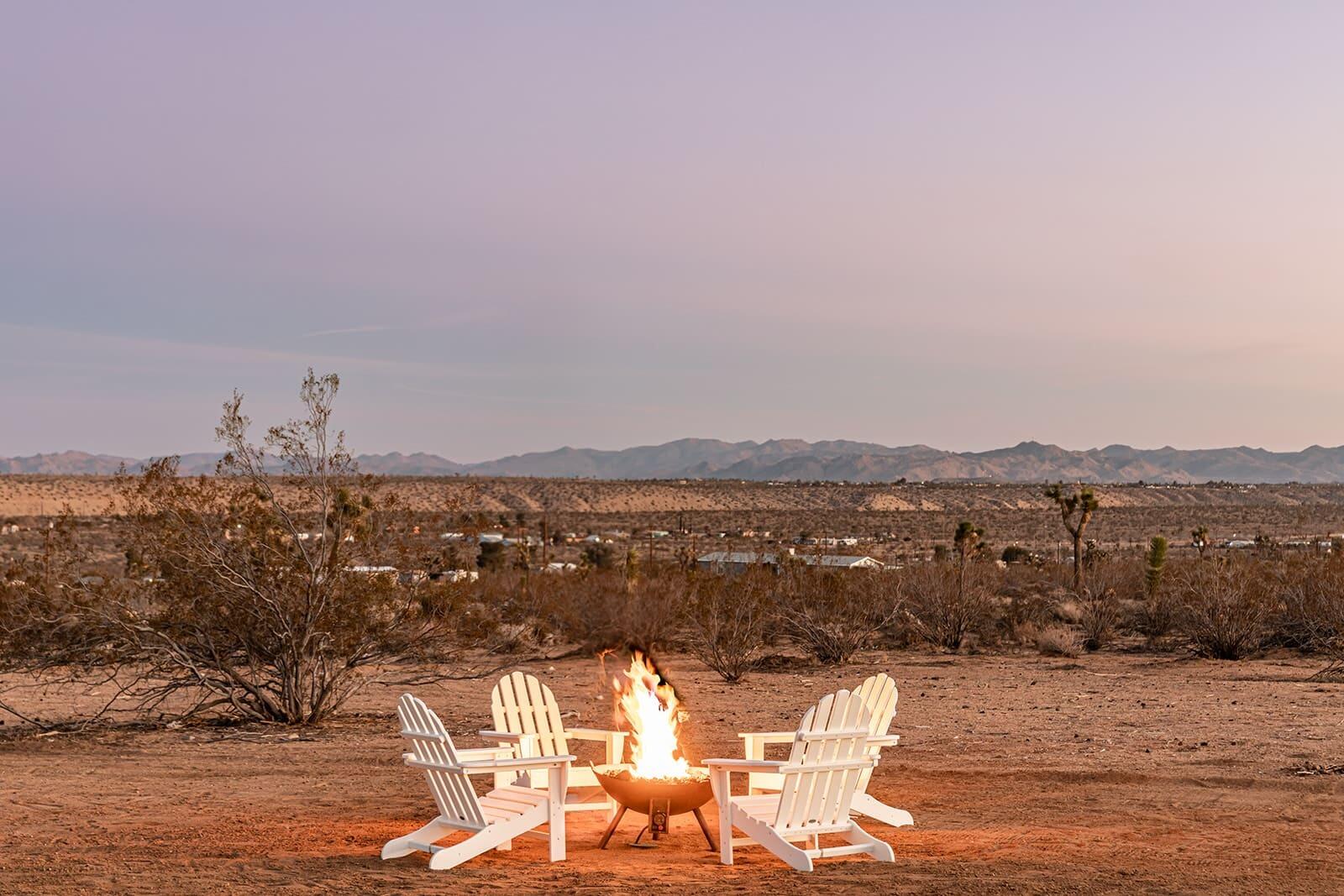 55717 Ruth Lane Yucca Valley, CA 92284 - Photo 8 of 32 a view of a terrace with a table and chairs