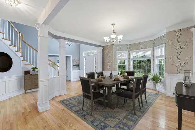 a view of a dining room with furniture window and wooden floor