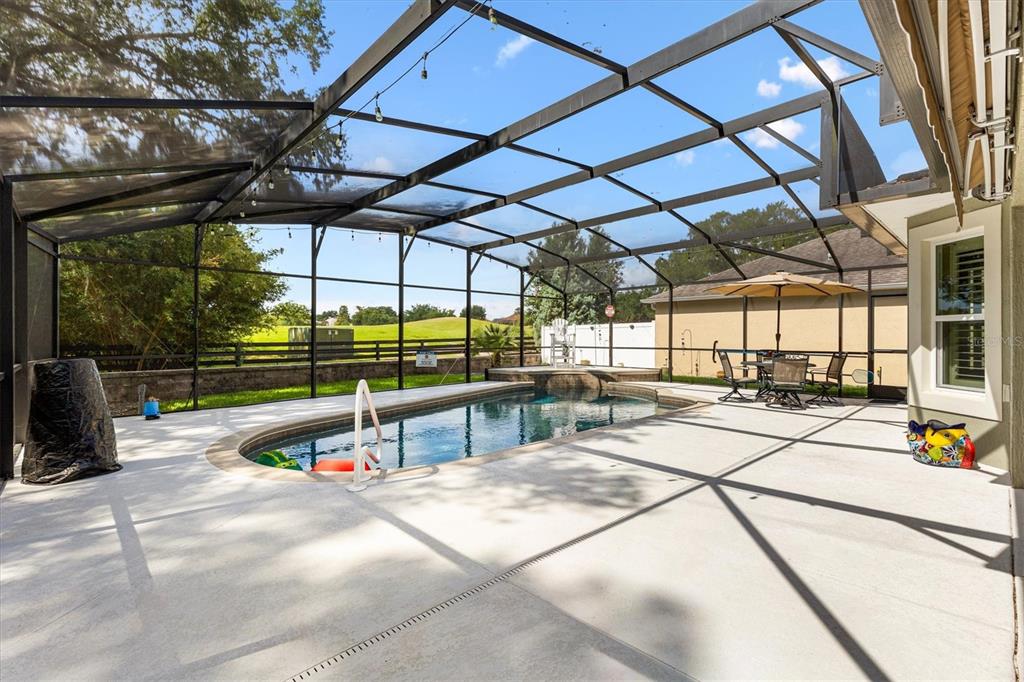7351 Southeast 169th Cote Loop The Villages, FL 32162 - Photo 22 of 32 a view of a swimming pool with a patio