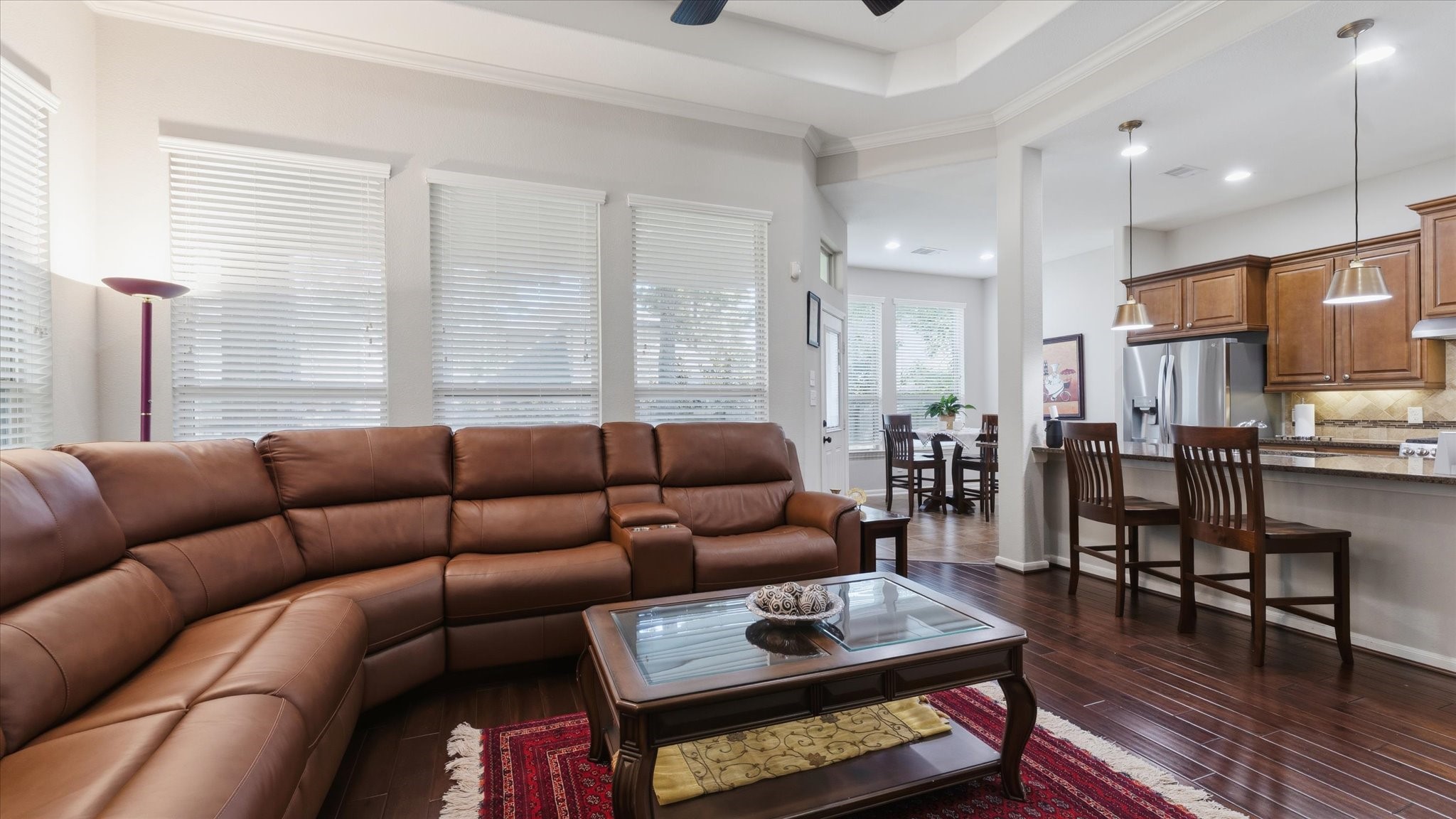 14 Painted Post Place Spring, TX 77389 - Photo 13 of 43 a living room with furniture wooden floor and a large window