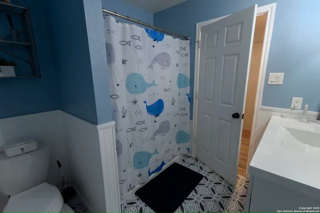 a bathroom with a sink and toilet