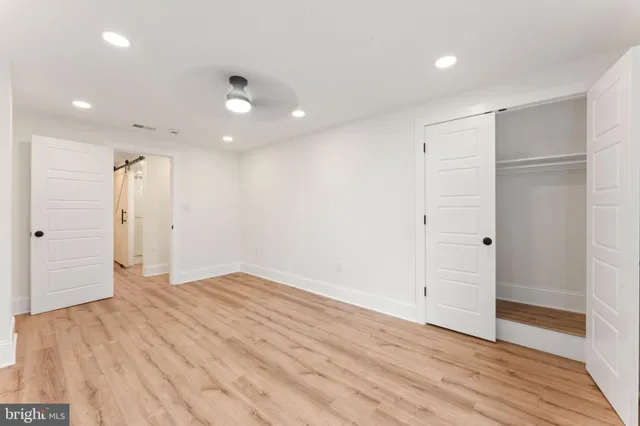 a view of empty room with wooden walls
