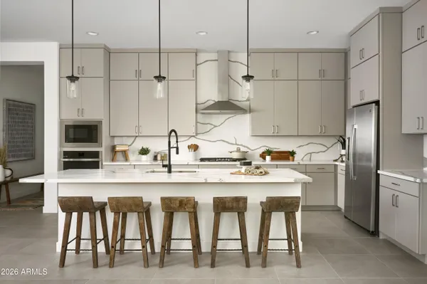a kitchen with a sink cabinets and appliances