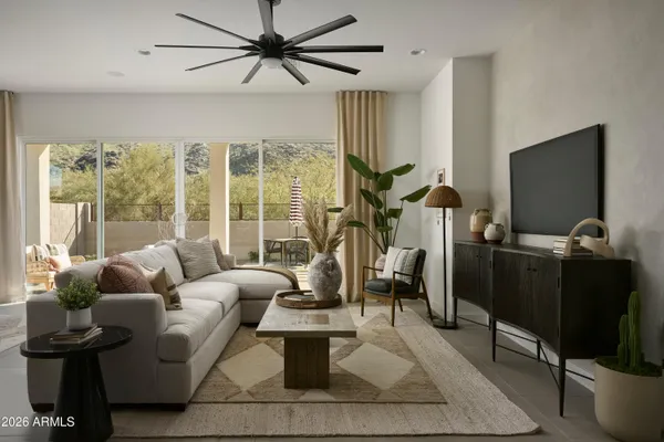 a living room with stainless steel appliances kitchen island granite countertop furniture and a view of kitchen