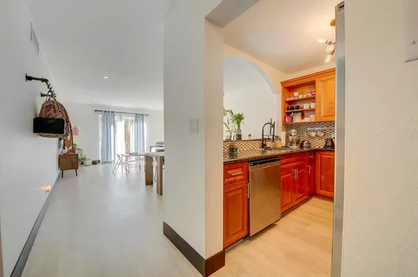 a kitchen with stainless steel appliances a refrigerator and a sink