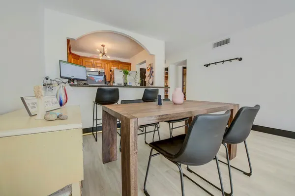 a dining room with a table and chairs