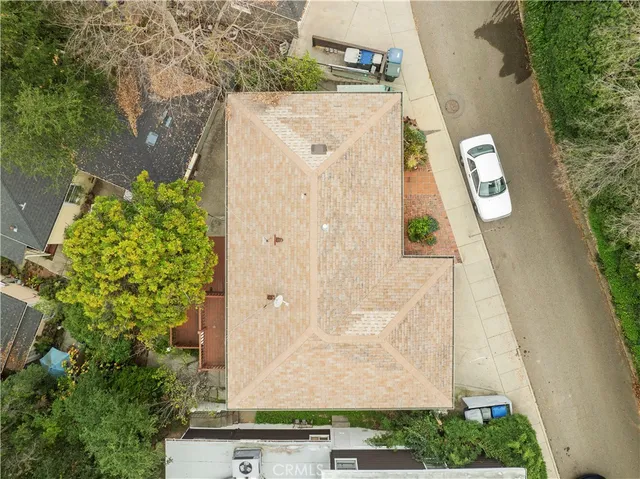 an aerial view of a residential houses with outdoor space
