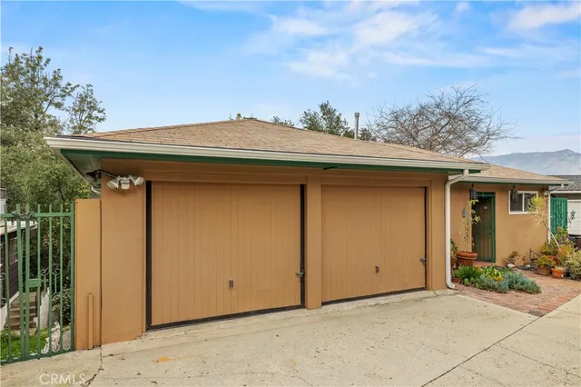 an aerial view of a residential houses with outdoor space