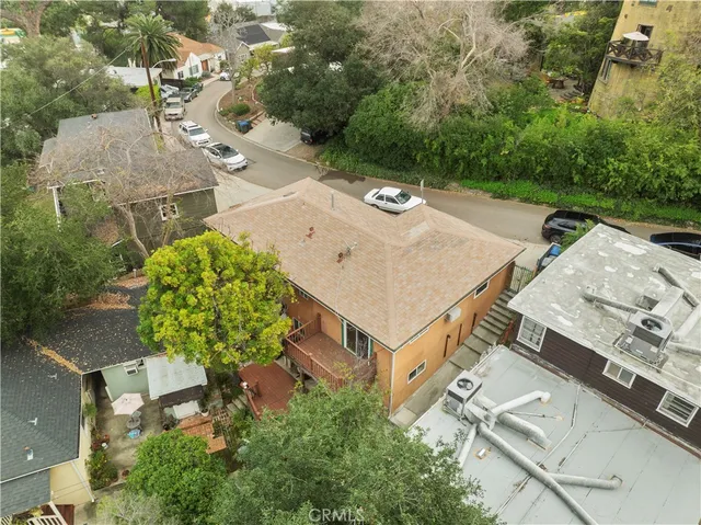 an aerial view of a house with yard