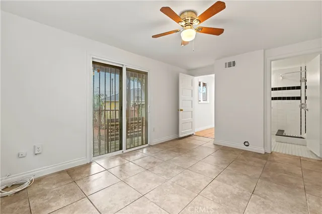 a bathroom with a shower and a sink
