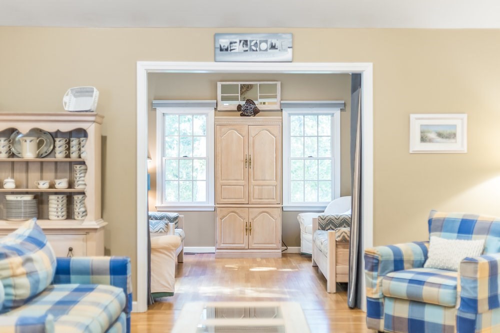 3 Stephen Hopkins Road Harwich, MA 02645 - Photo 12 of 42 a living room with furniture and a large window
