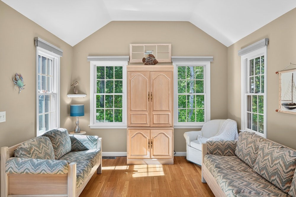 3 Stephen Hopkins Road Harwich, MA 02645 - Photo 13 of 42 a living room with furniture and a large window