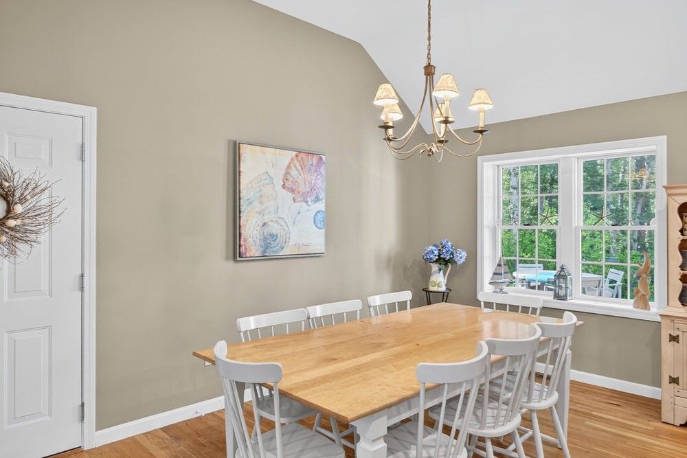 3 Stephen Hopkins Road Harwich, MA 02645 - Photo 15 of 42 a dining room with a table and chairs