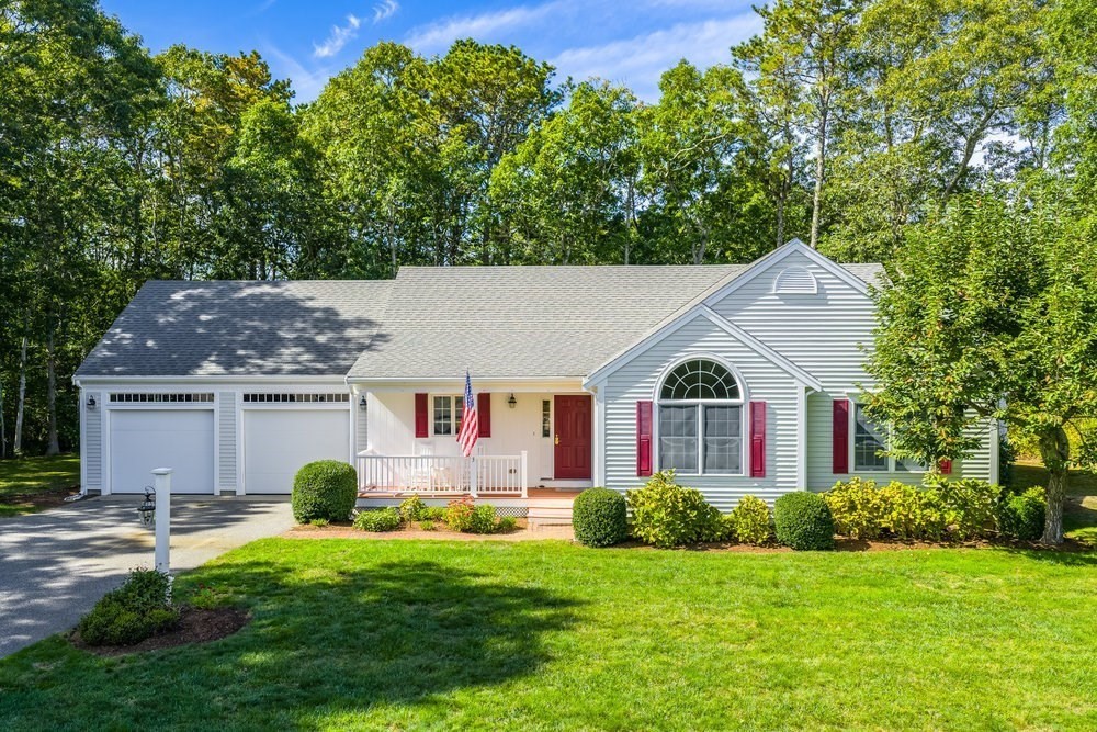 3 Stephen Hopkins Road Harwich, MA 02645 - Photo 2 of 42 a front view of a house with a yard