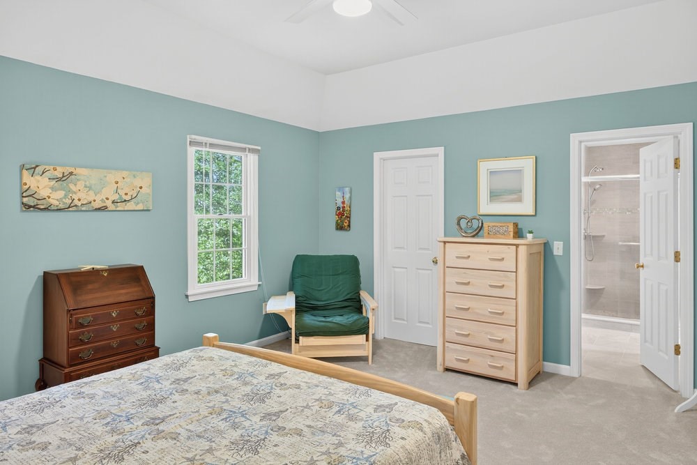 3 Stephen Hopkins Road Harwich, MA 02645 - Photo 22 of 42 a bedroom with a bed and a chair