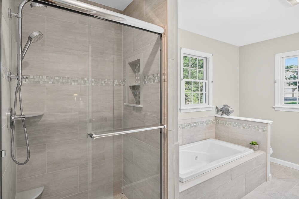 3 Stephen Hopkins Road Harwich, MA 02645 - Photo 24 of 42 a bathroom with a tub a sink and a shower