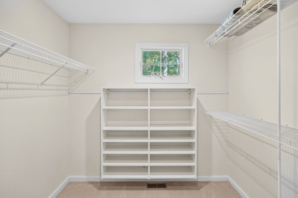 3 Stephen Hopkins Road Harwich, MA 02645 - Photo 25 of 42 a view of walk in closet with empty racks