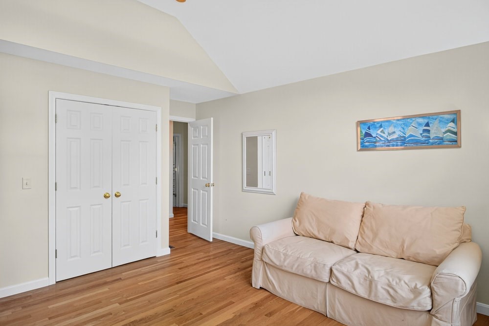 3 Stephen Hopkins Road Harwich, MA 02645 - Photo 29 of 42 a living room with furniture and a wooden floor