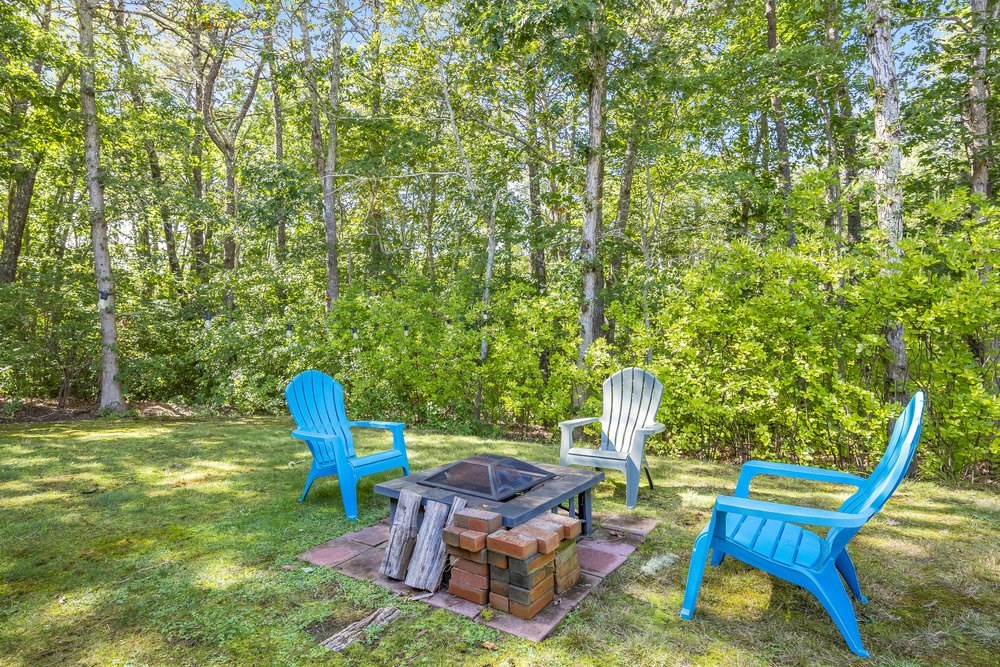 3 Stephen Hopkins Road Harwich, MA 02645 - Photo 37 of 42 a view of a backyard with chairs