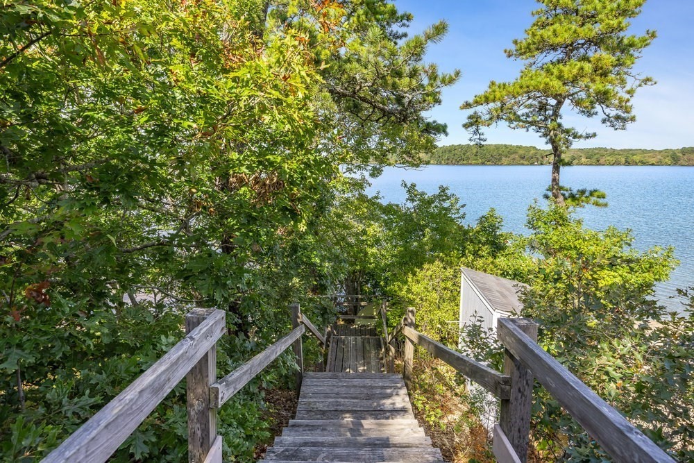 3 Stephen Hopkins Road Harwich, MA 02645 - Photo 42 of 42 a view of a pathway with a wrought fence