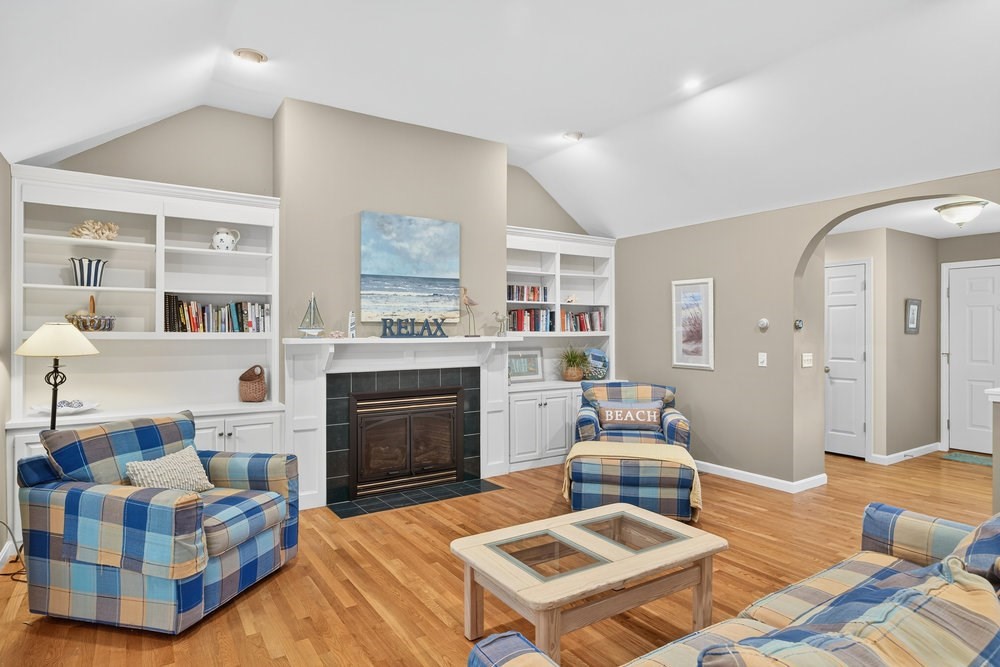 3 Stephen Hopkins Road Harwich, MA 02645 - Photo 9 of 42 a bedroom with furniture and a fireplace