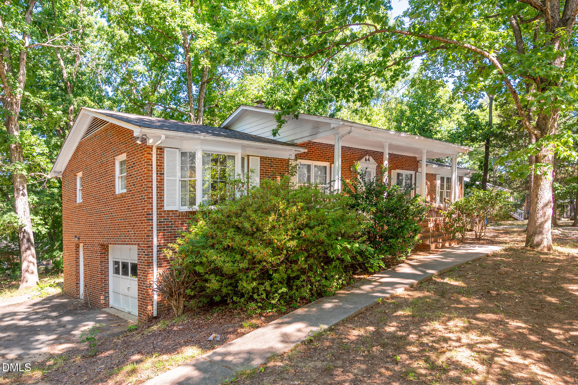 4411 Rhew Drive Durham, NC 27704 - Photo 2 of 34 a front view of a house with a yard