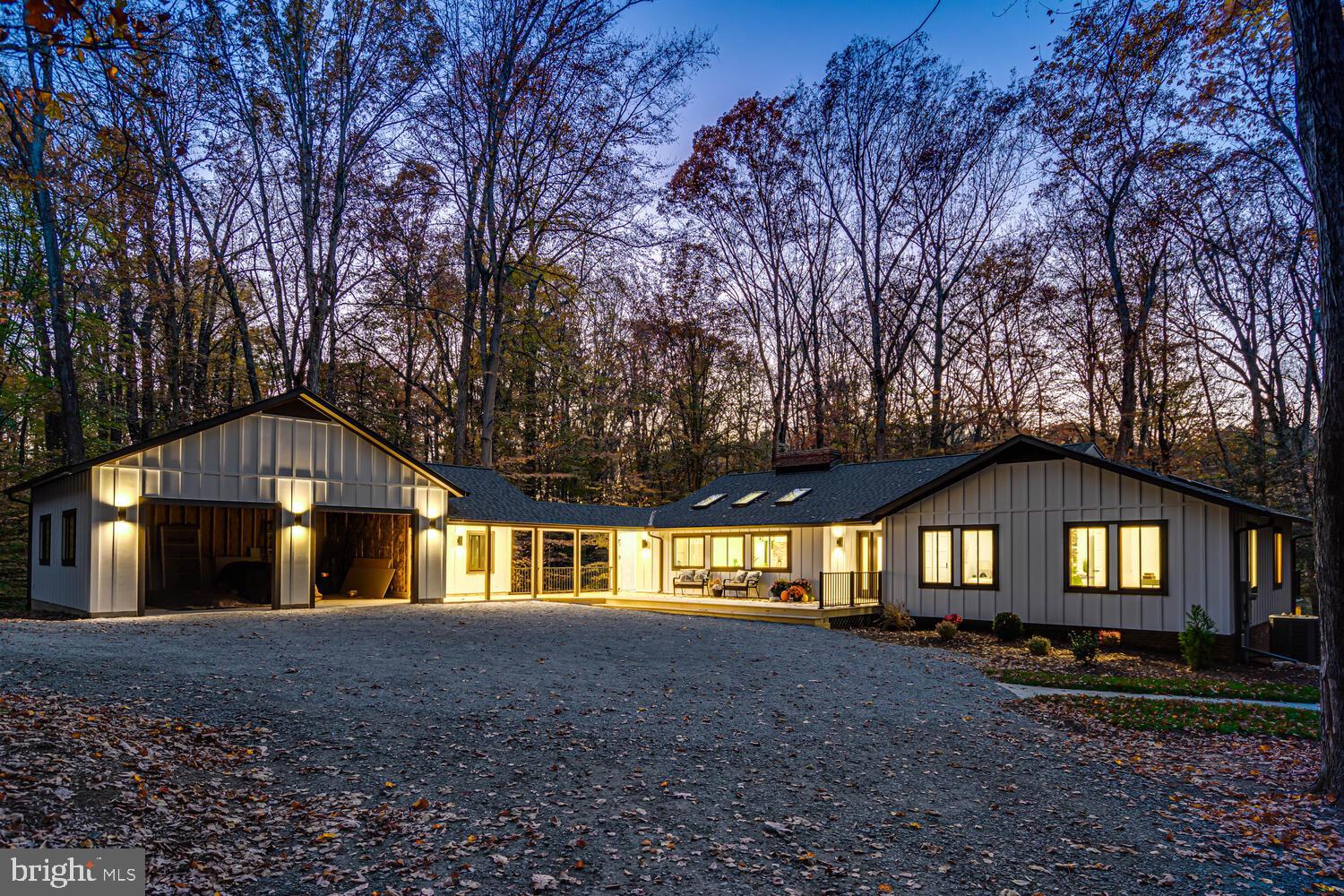 108 Interpromontory Road Great Falls, VA 22066 - Photo 106 of 108 a front view of a house with a yard