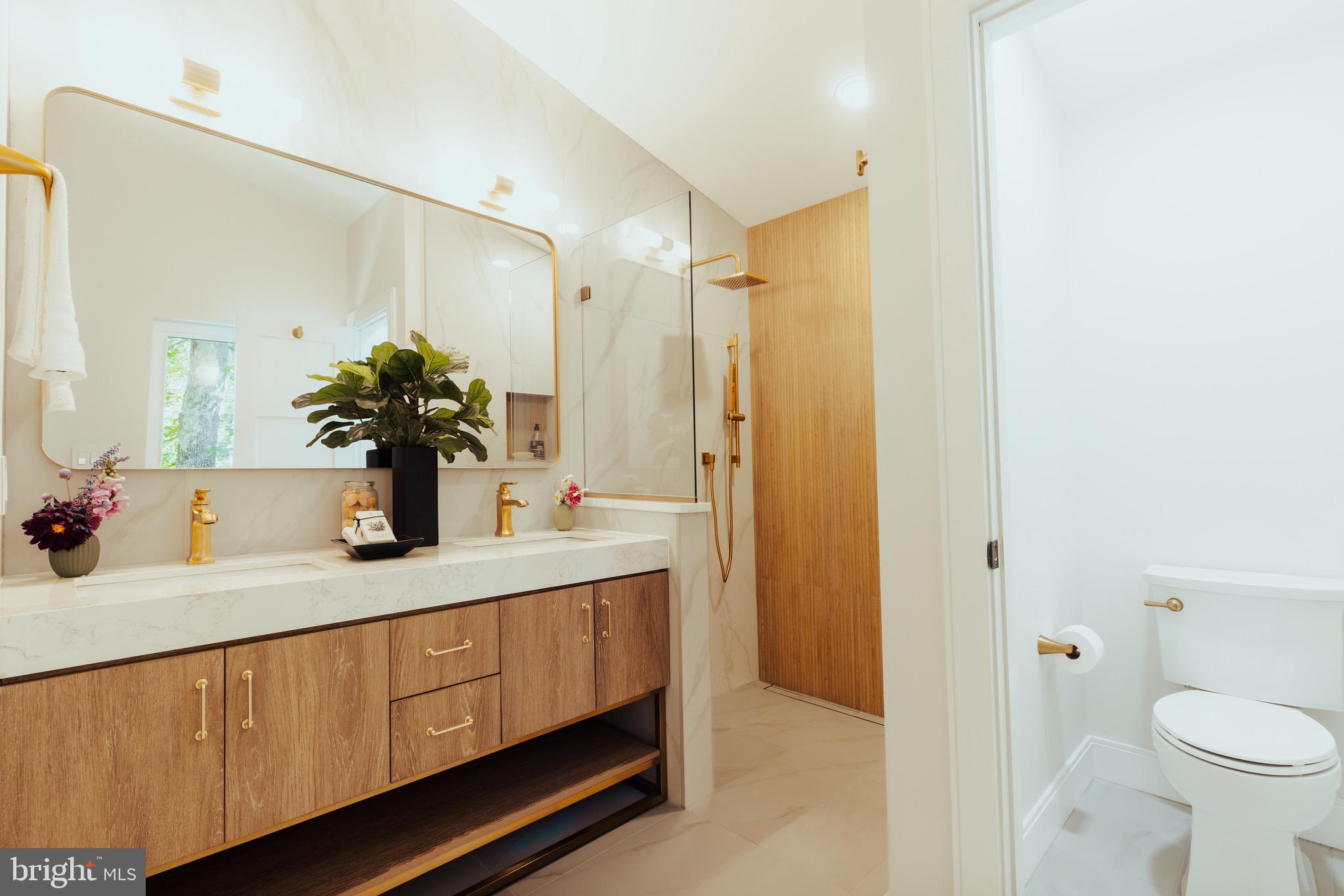 108 Interpromontory Road Great Falls, VA 22066 - Photo 11 of 108 a bathroom with a granite countertop sink and a mirror