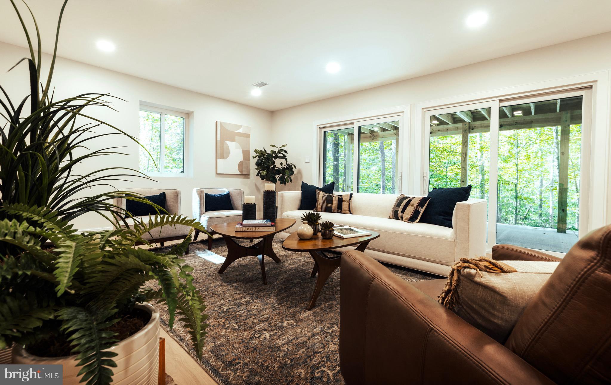 108 Interpromontory Road Great Falls, VA 22066 - Photo 13 of 108 a living room with furniture fireplace and large windows