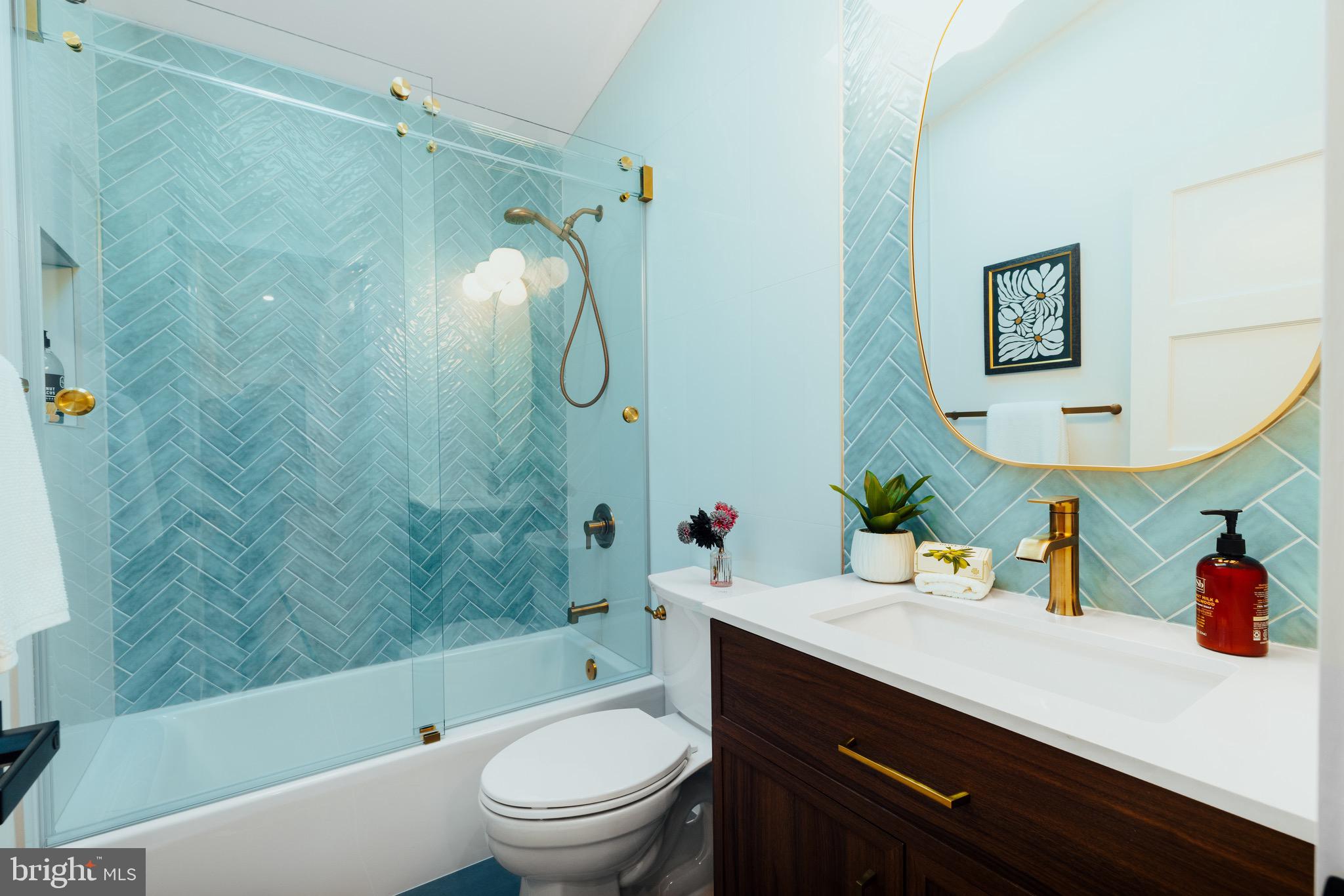 108 Interpromontory Road Great Falls, VA 22066 - Photo 15 of 108 a bathroom with a sink vanity mirror bathtub and toilet