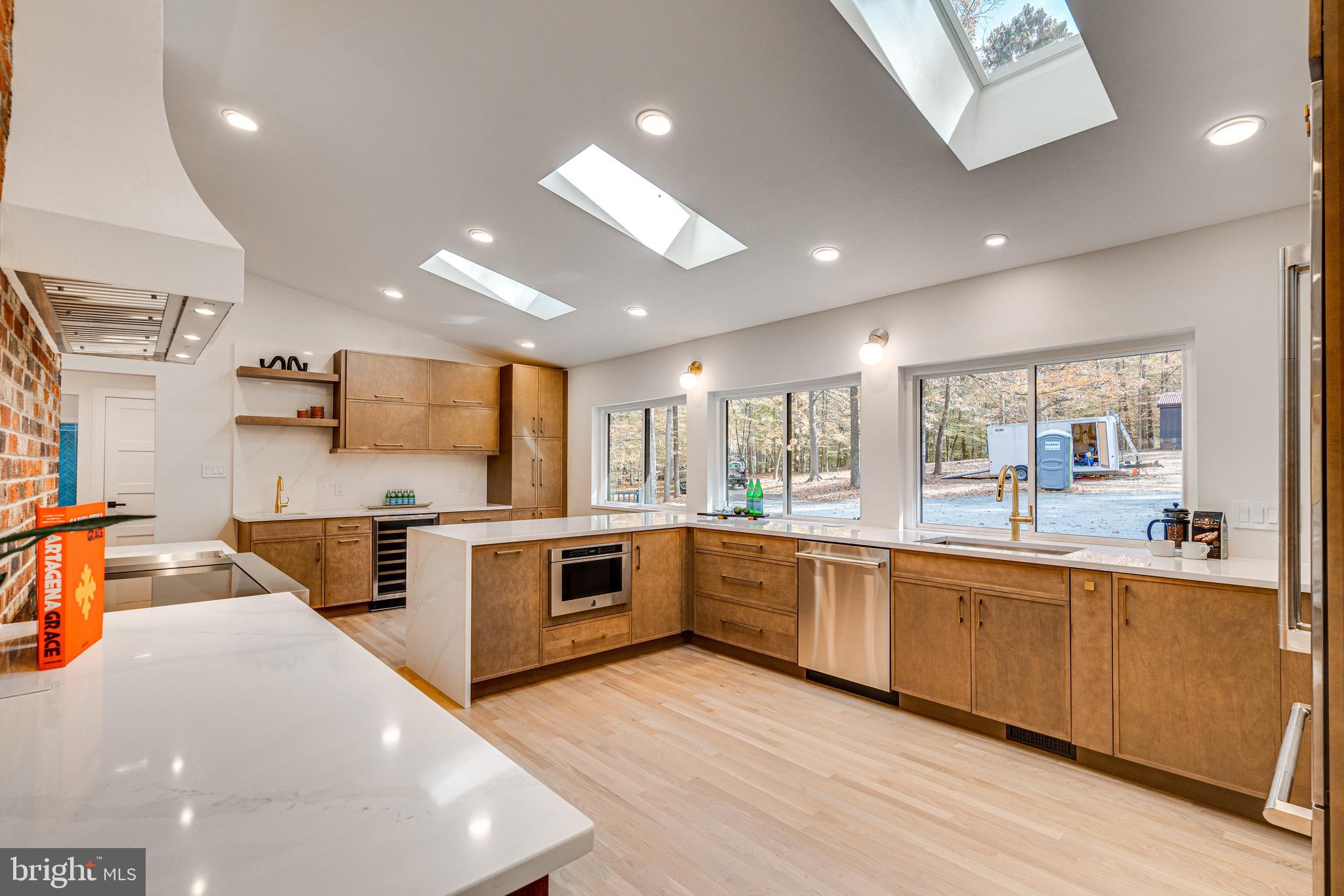108 Interpromontory Road Great Falls, VA 22066 - Photo 19 of 93 a large kitchen with stainless steel appliances lots of counter top space