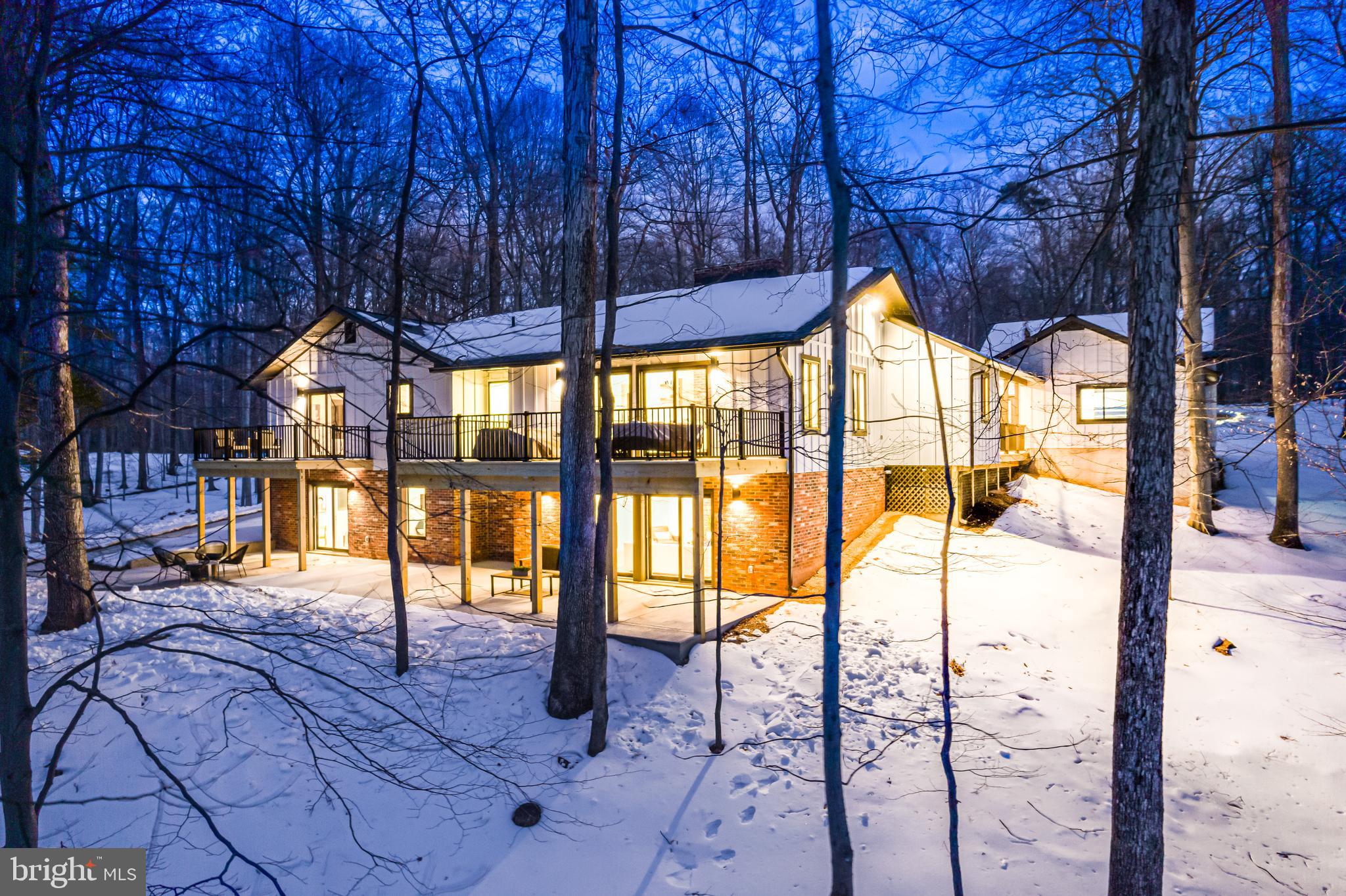 108 Interpromontory Road Great Falls, VA 22066 - Photo 2 of 108 a porch with a table in balcony