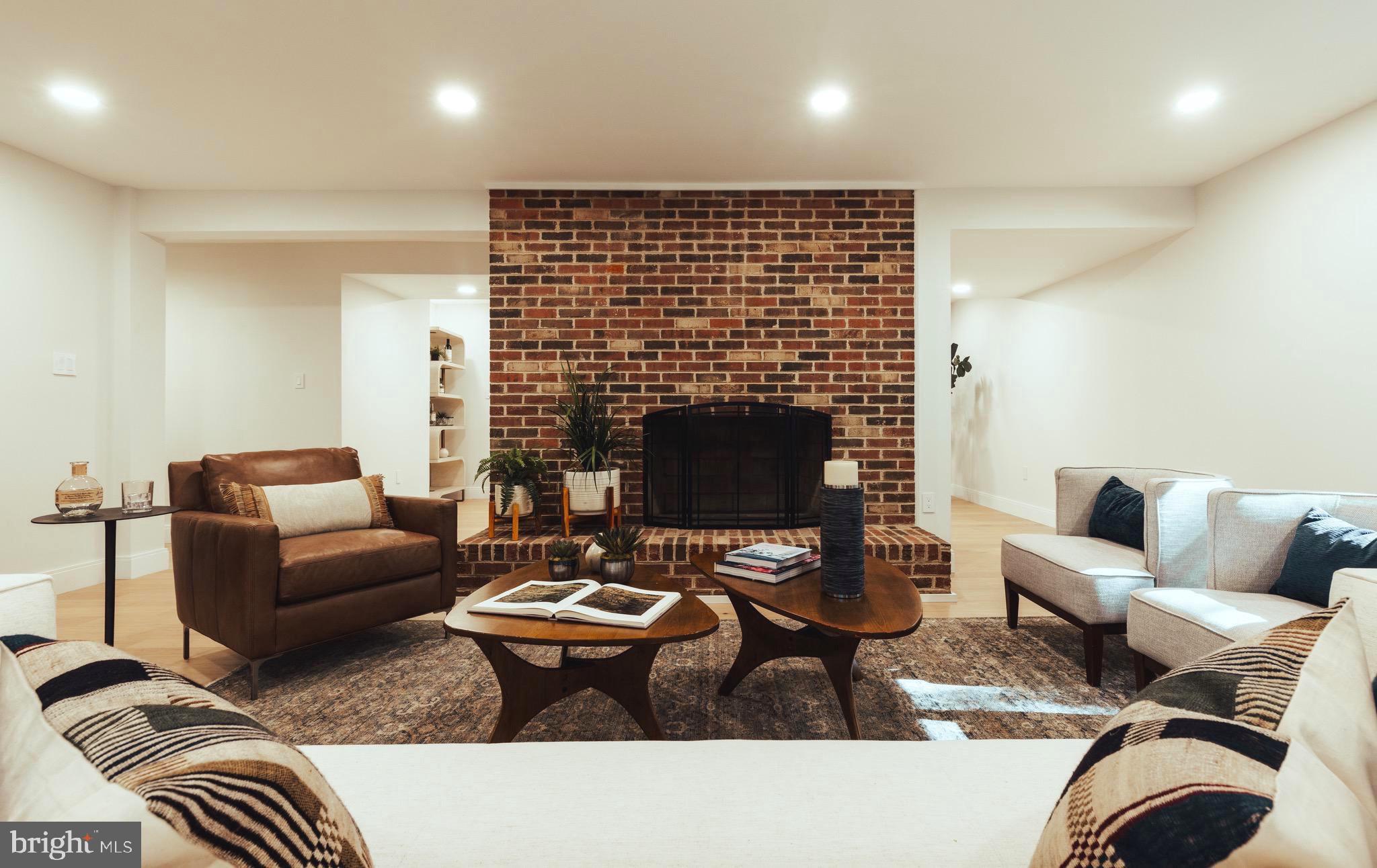 108 Interpromontory Road Great Falls, VA 22066 - Photo 21 of 108 a living room with furniture and a fireplace