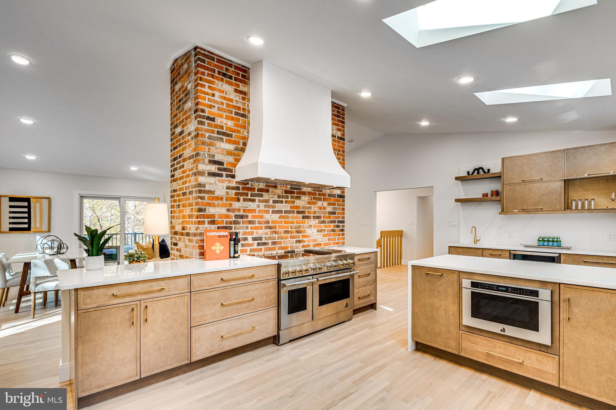 108 Interpromontory Road Great Falls, VA 22066 - Photo 20 of 93 a kitchen with stainless steel appliances a stove sink and cabinets