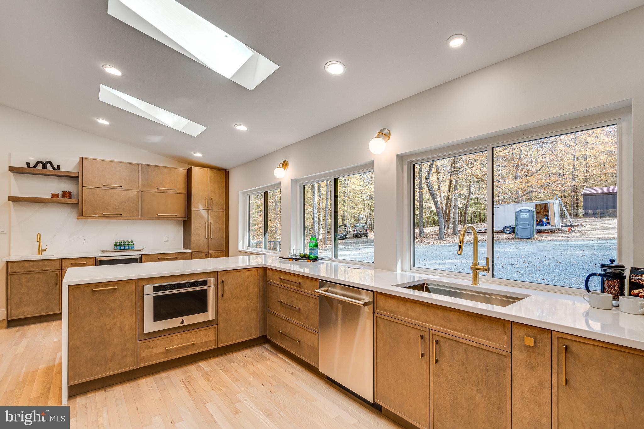 108 Interpromontory Road Great Falls, VA 22066 - Photo 21 of 93 a large kitchen with a large window and stainless steel appliances