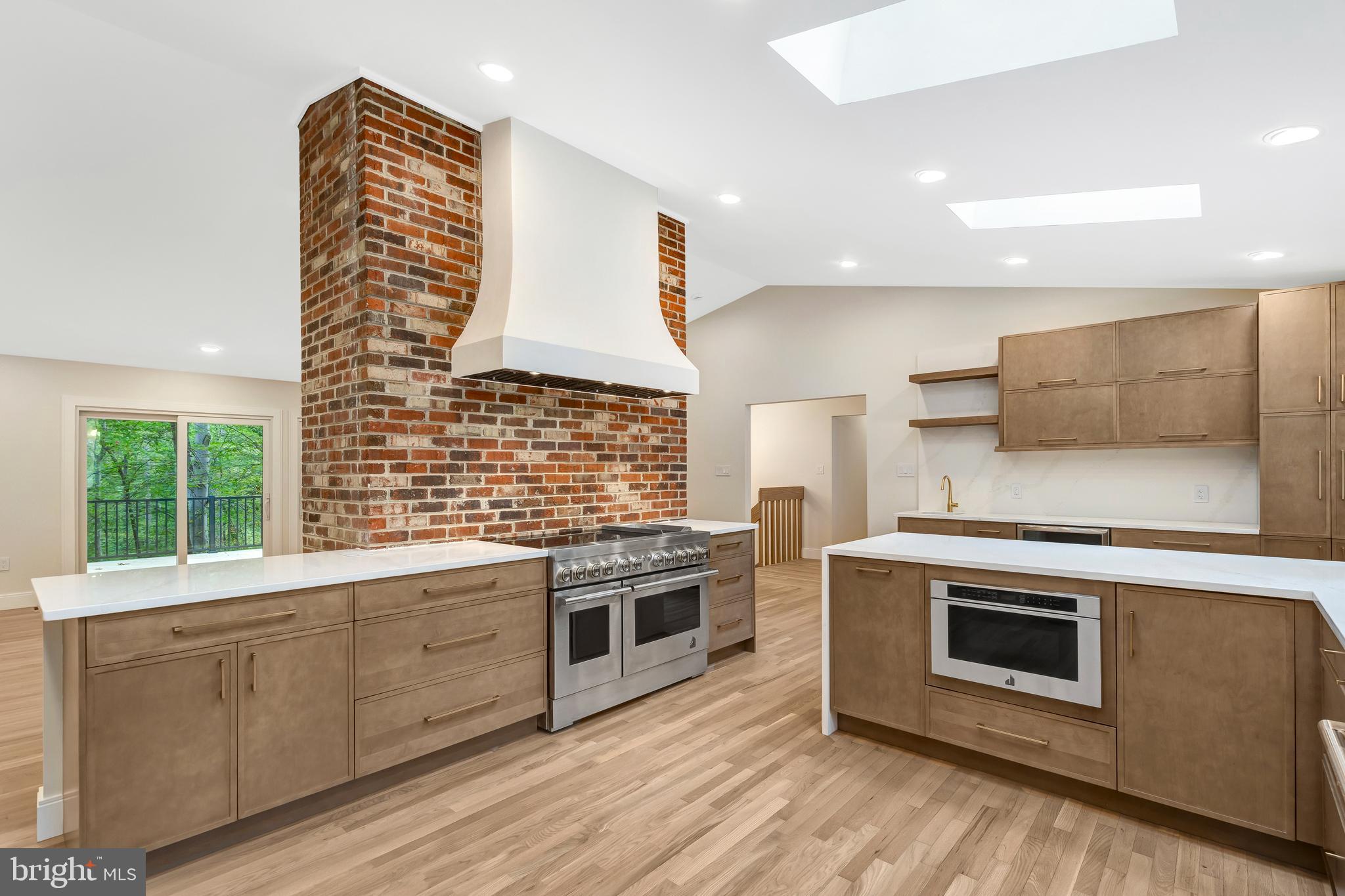 108 Interpromontory Road Great Falls, VA 22066 - Photo 28 of 93 a kitchen with stainless steel appliances granite countertop a stove and a sink