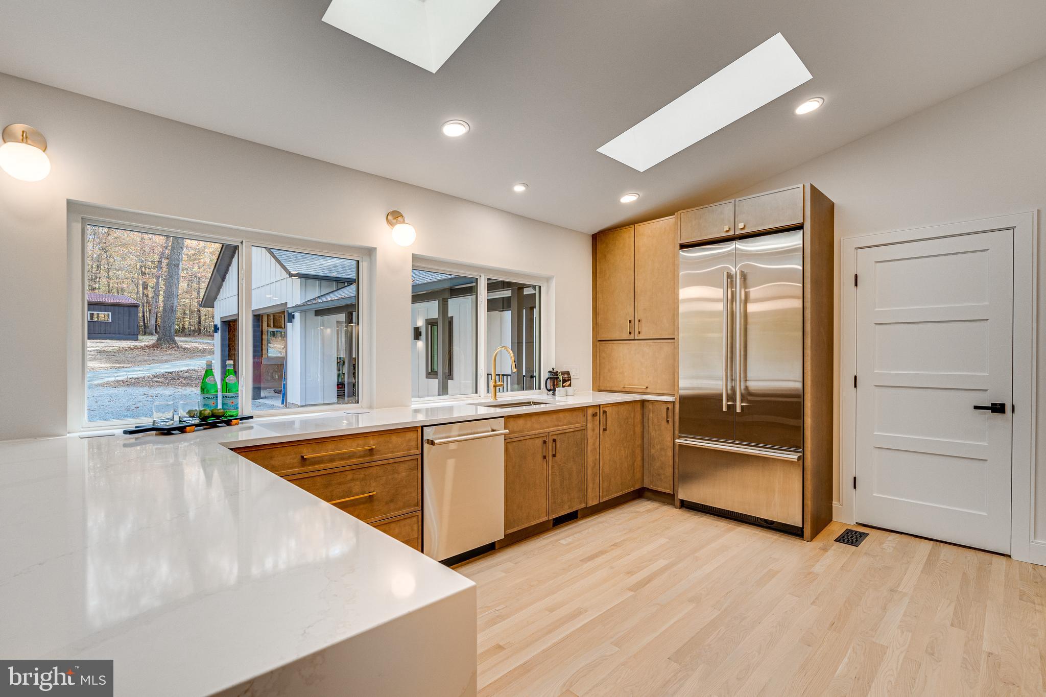 108 Interpromontory Road Great Falls, VA 22066 - Photo 30 of 93 a large white kitchen with sink refrigerator and large window