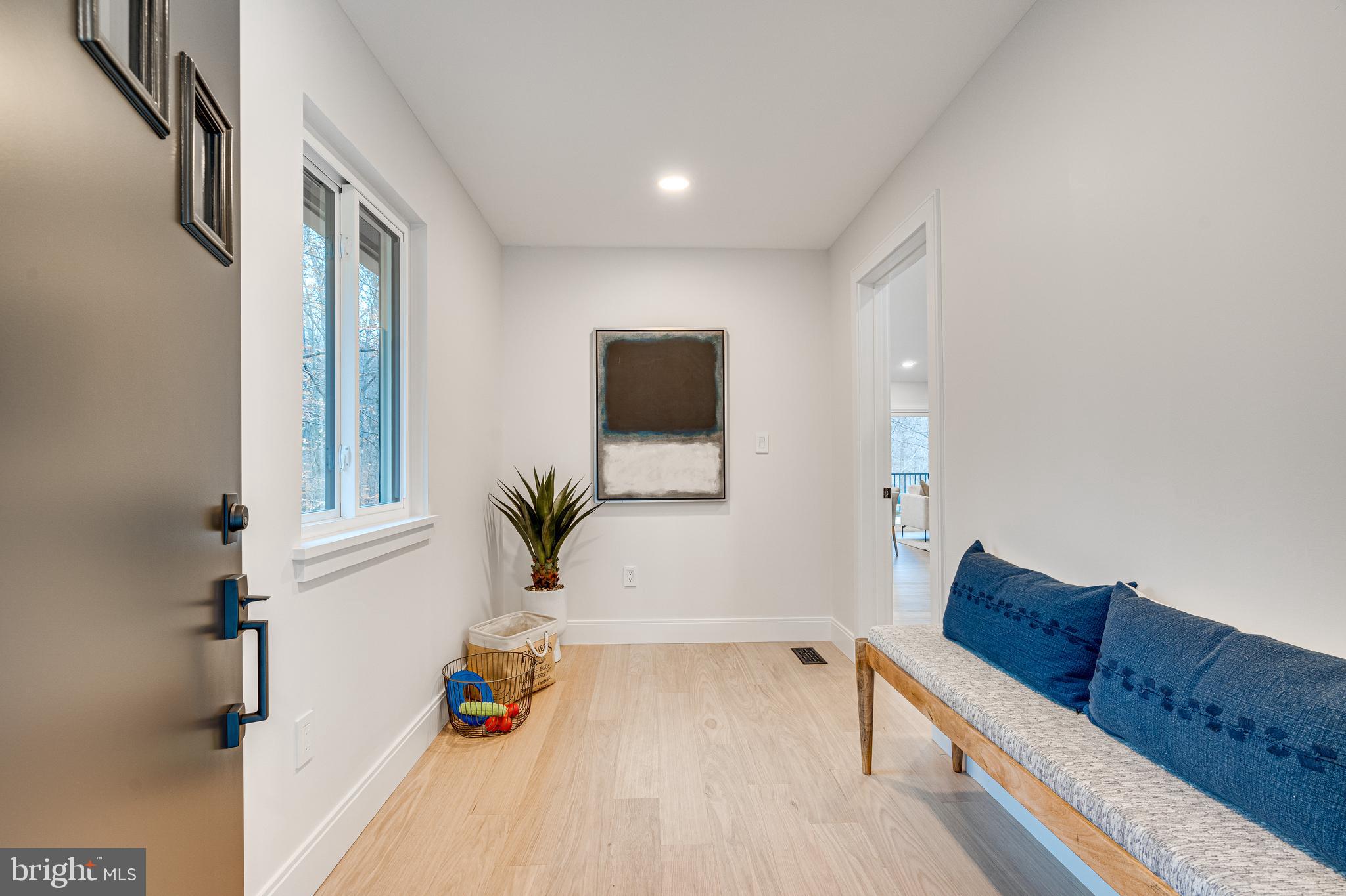 108 Interpromontory Road Great Falls, VA 22066 - Photo 32 of 93 a living room with furniture and a flat screen tv