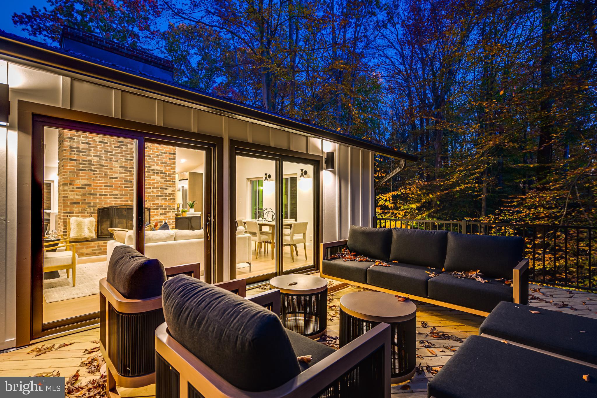 108 Interpromontory Road Great Falls, VA 22066 - Photo 39 of 108 a living room with furniture and a floor to ceiling window
