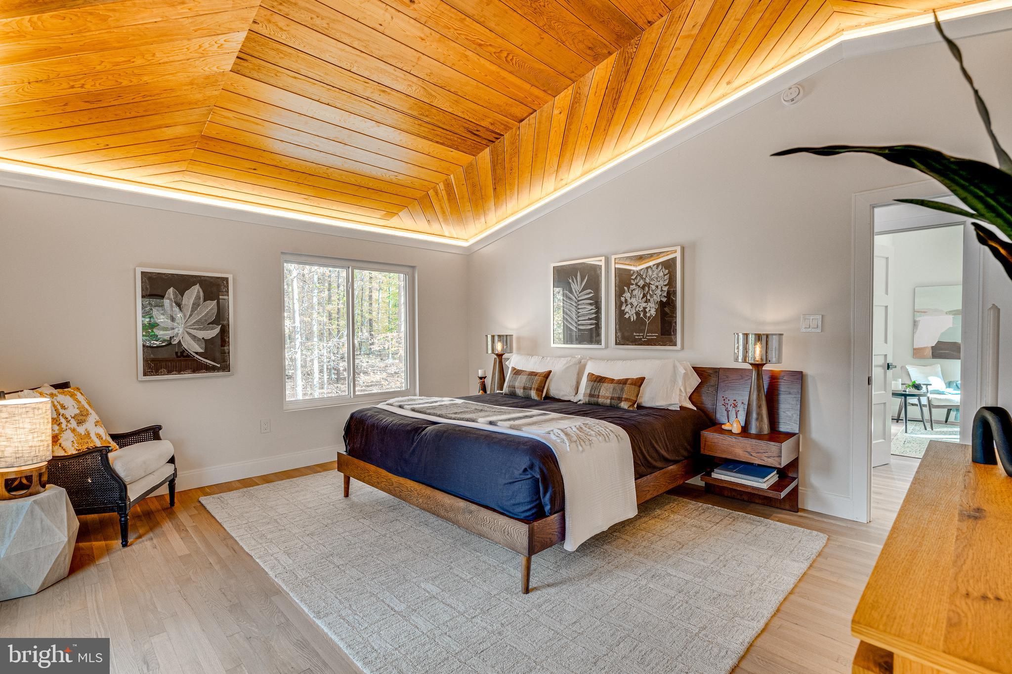 108 Interpromontory Road Great Falls, VA 22066 - Photo 42 of 93 a spacious bedroom with a bed and window