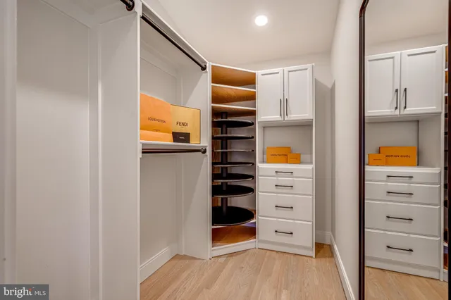 a outdoor space with the couches and dining table with wooden floor