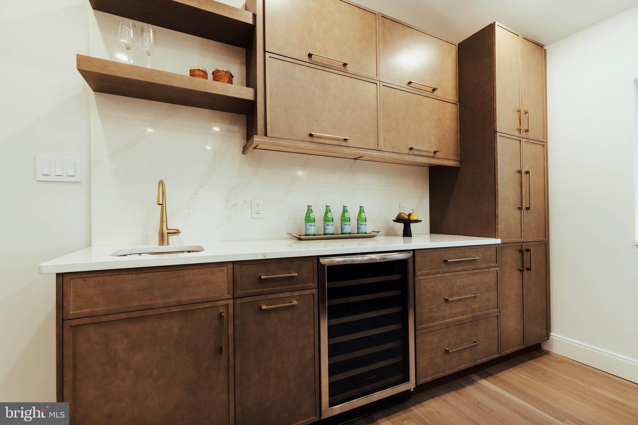 108 Interpromontory Road Great Falls, VA 22066 - Photo 5 of 108 a kitchen with stainless steel appliances granite countertop a sink a stove and cabinets