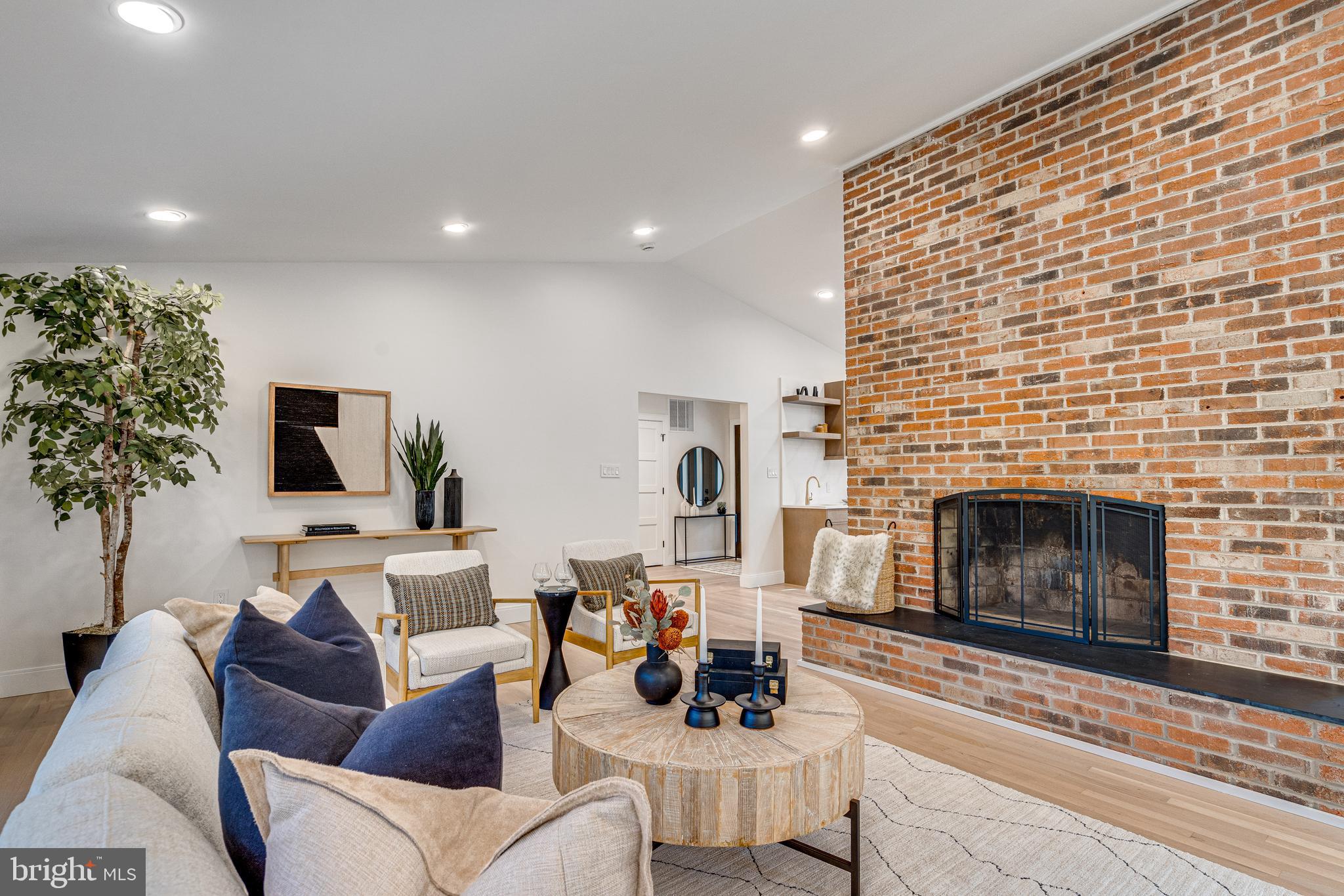 108 Interpromontory Road Great Falls, VA 22066 - Photo 52 of 108 a living room with furniture and a fireplace