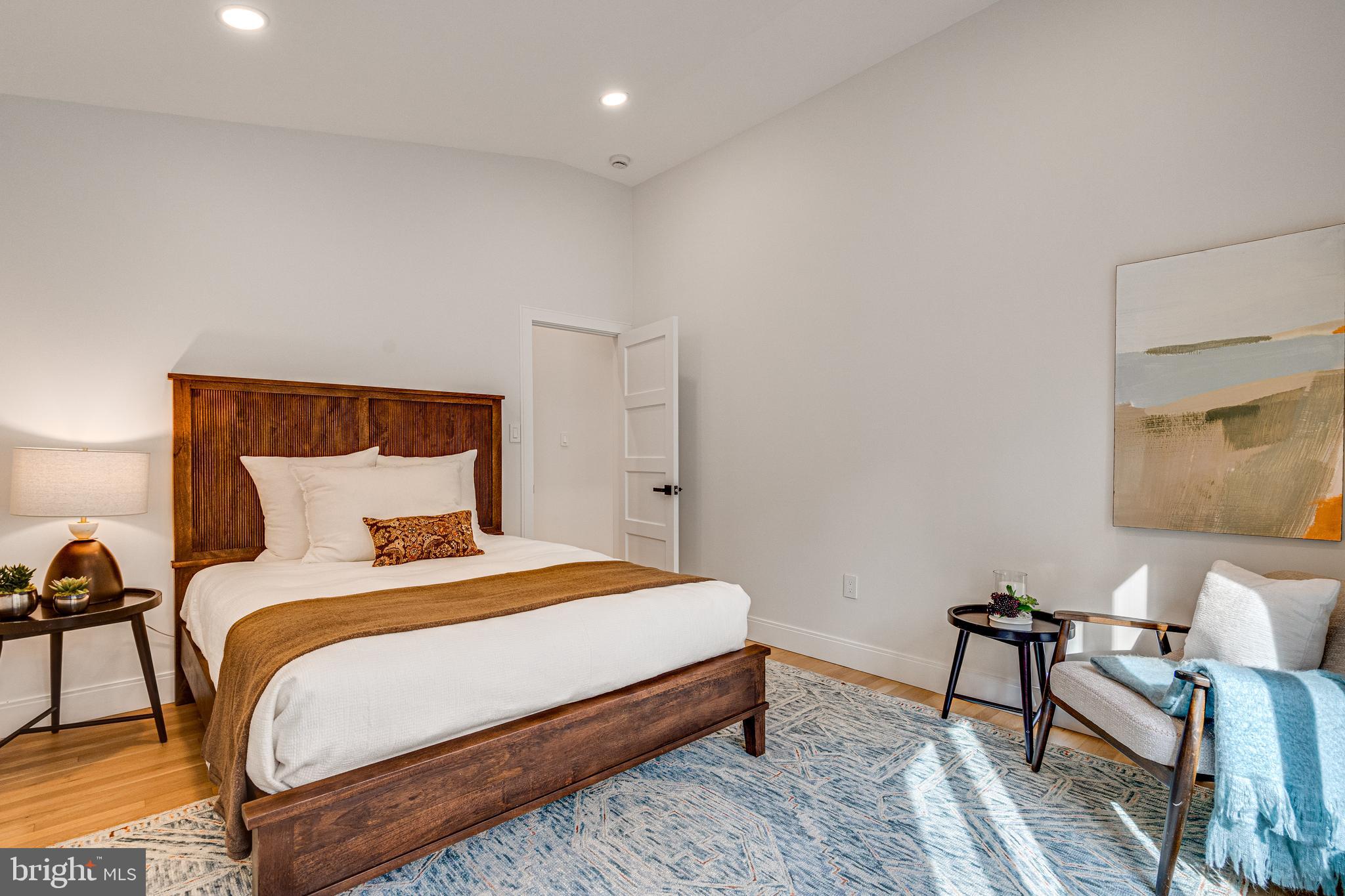 108 Interpromontory Road Great Falls, VA 22066 - Photo 55 of 93 a bedroom with a bed and a couch