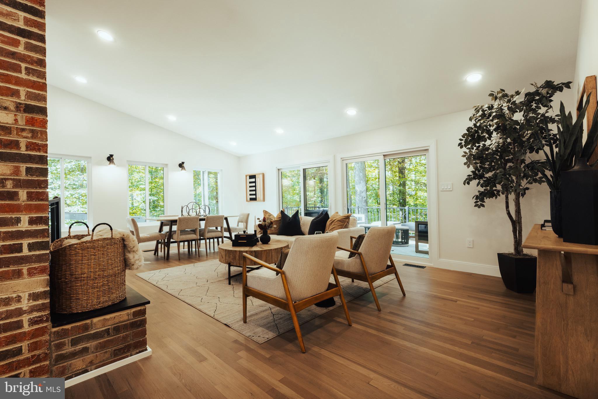 108 Interpromontory Road Great Falls, VA 22066 - Photo 6 of 108 a living room with furniture a large window and wooden floor