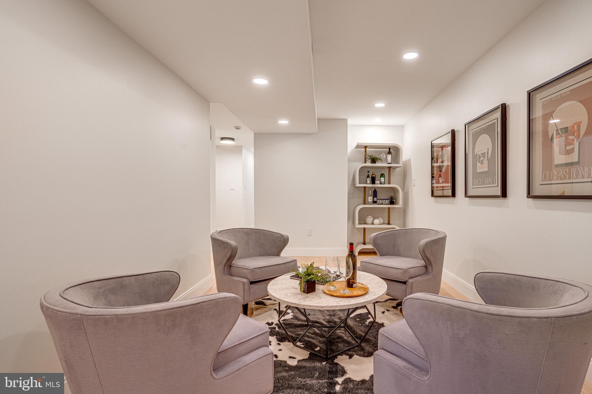 108 Interpromontory Road Great Falls, VA 22066 - Photo 63 of 93 a living room with furniture and a chair