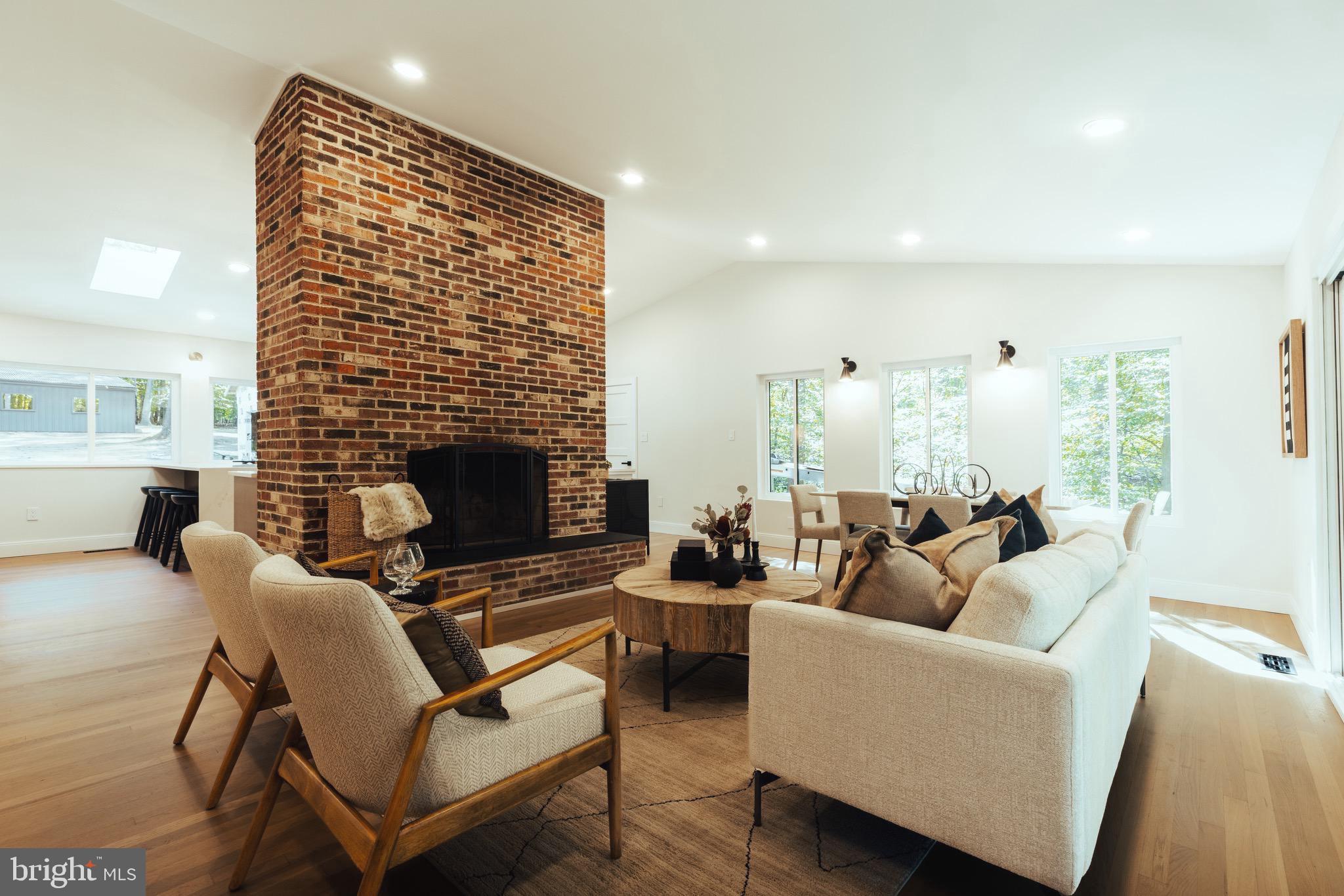 108 Interpromontory Road Great Falls, VA 22066 - Photo 7 of 108 a living room with furniture and a fireplace