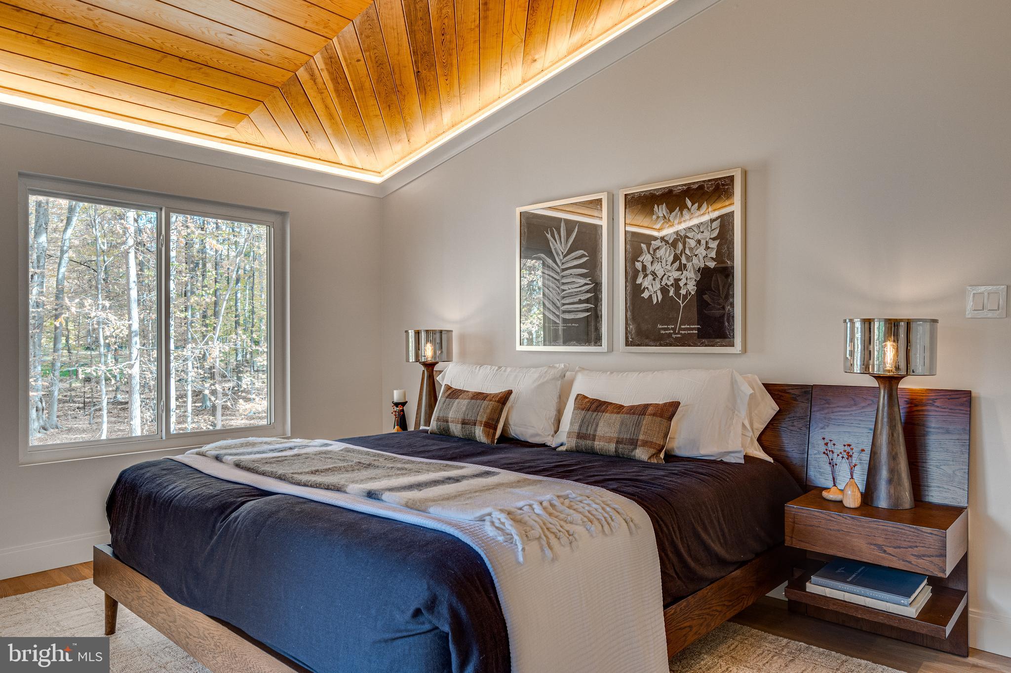 108 Interpromontory Road Great Falls, VA 22066 - Photo 7 of 93 a bedroom with a bed and wooden floor