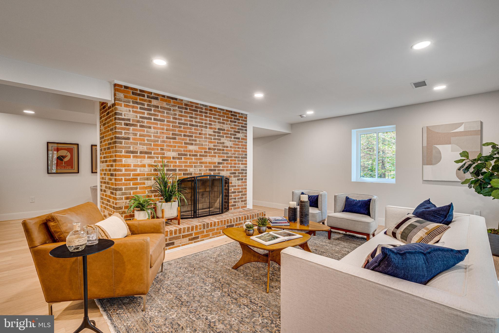 108 Interpromontory Road Great Falls, VA 22066 - Photo 74 of 108 a living room with furniture and a fireplace